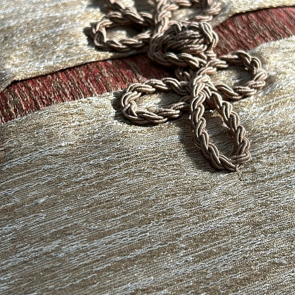 Unbranded braided cord accent pillow. Approximately 16” square.